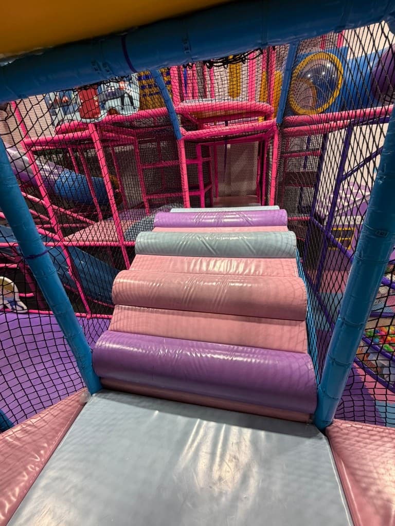 Themed climbing structure with slides at Fun Factory Play Café