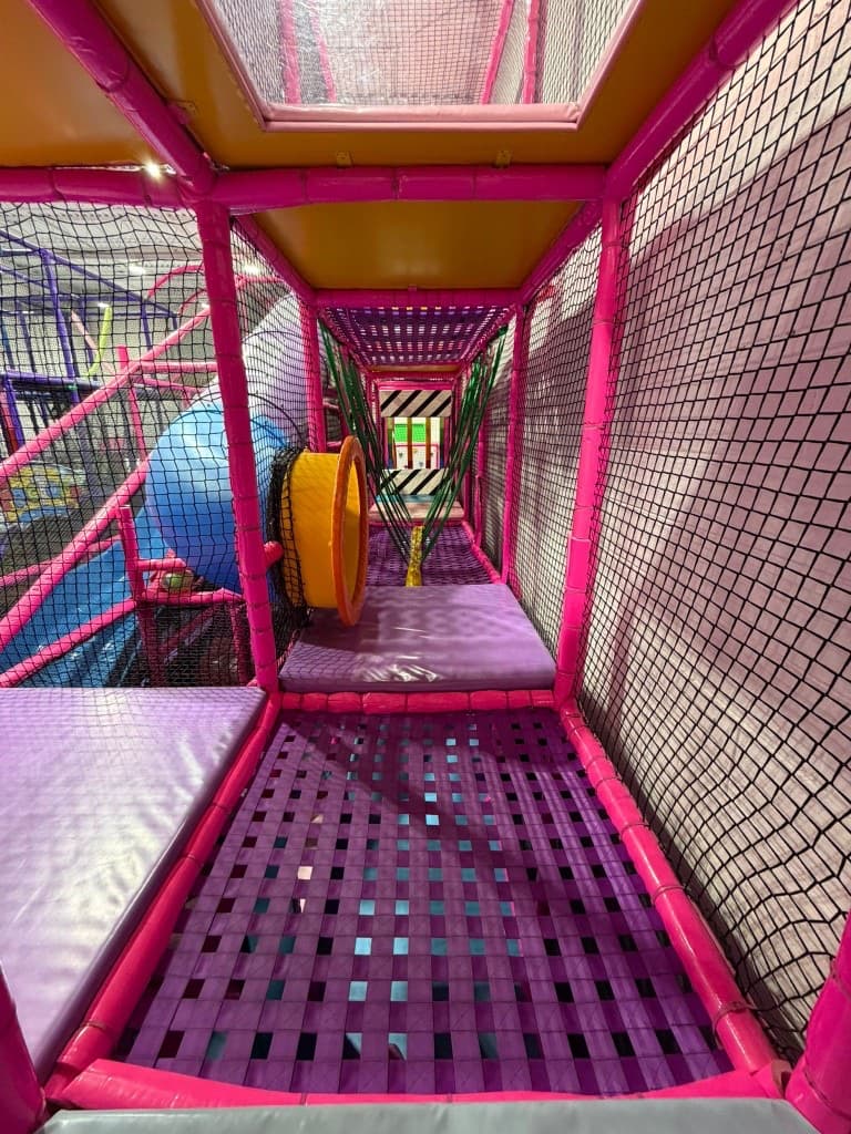 Large indoor playground with slides and climbing areas at Fun Factory